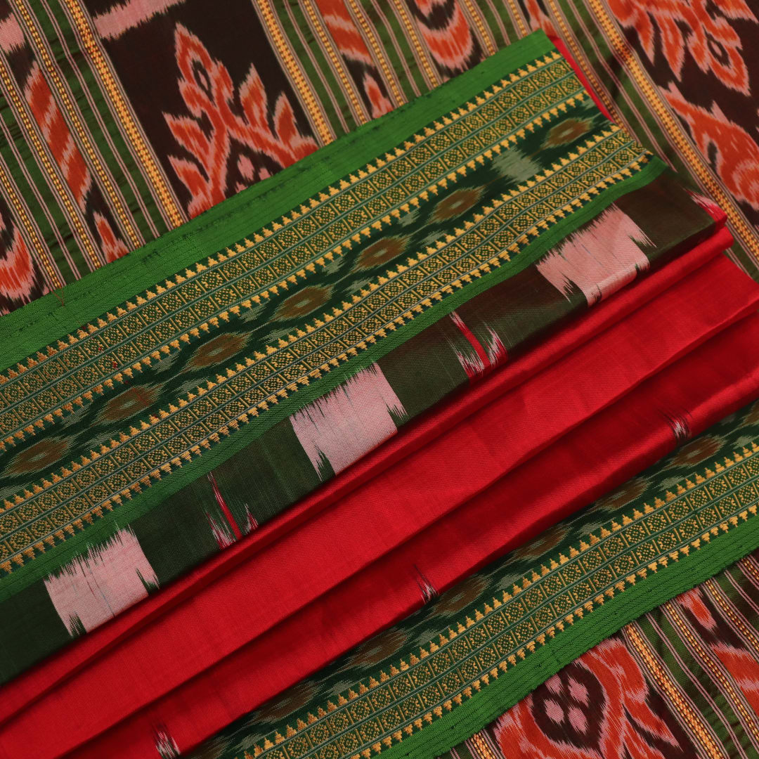 Red and green Khandua silk saree draped, showcasing the overall look and fall.