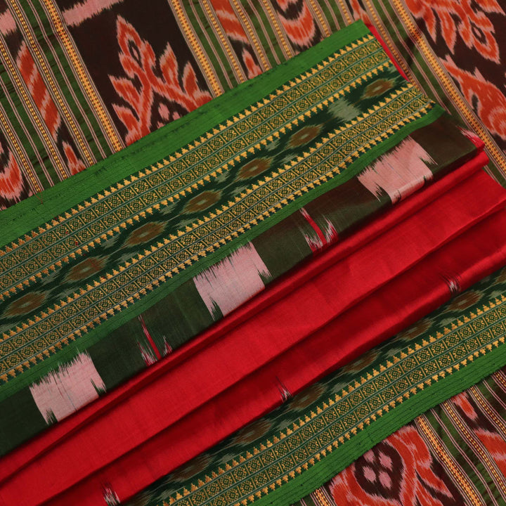 Red and green Khandua silk saree draped, showcasing the overall look and fall.
