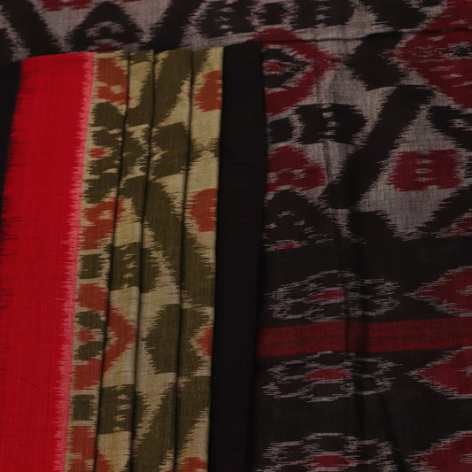 Green and black Sambalpuri cotton saree with motifs, elegantly draped for styling.