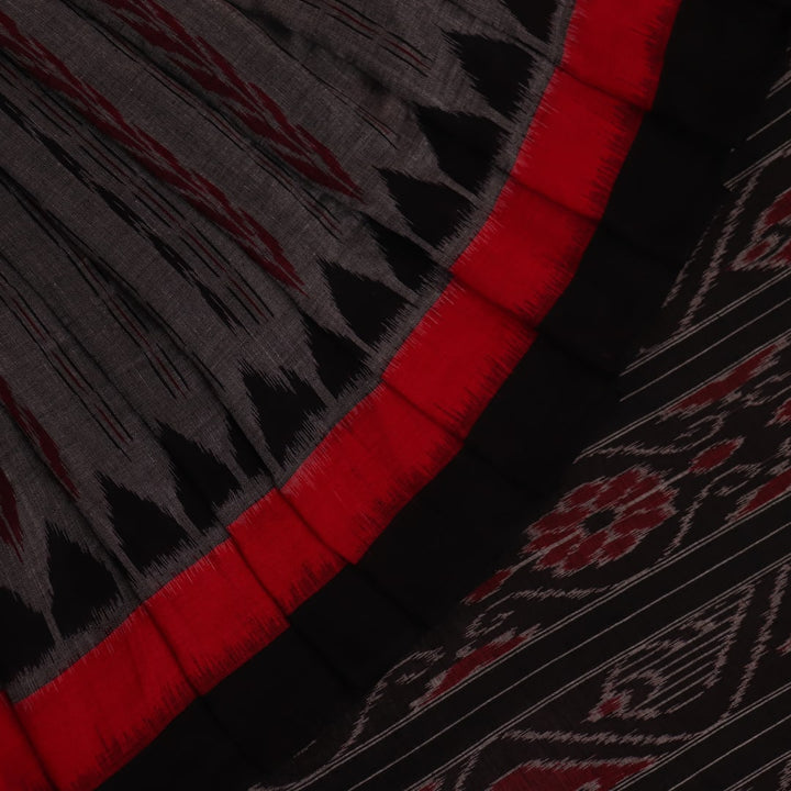 Grey and black Sambalpuri cotton saree draped, showcasing overall look and handloom texture.