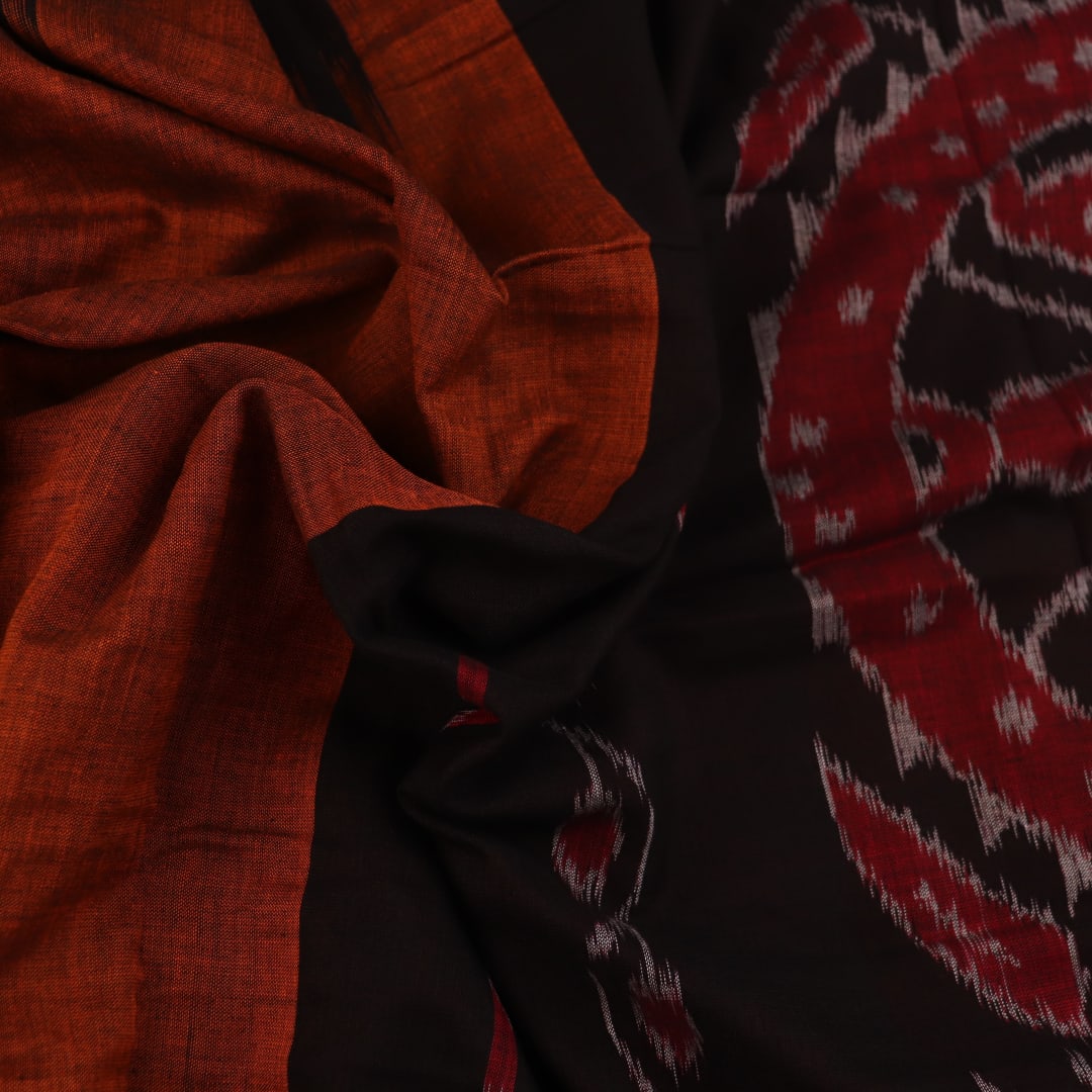 Brown and black plain Sambalpuri cotton saree elegantly draped.
