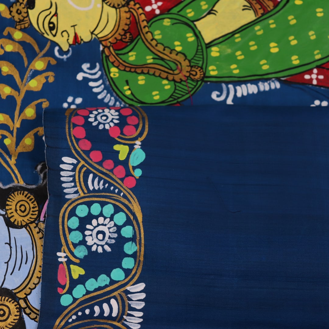 Close-up of the handwoven blue Patachitra silk saree, showcasing the detailed texture of the fabric.