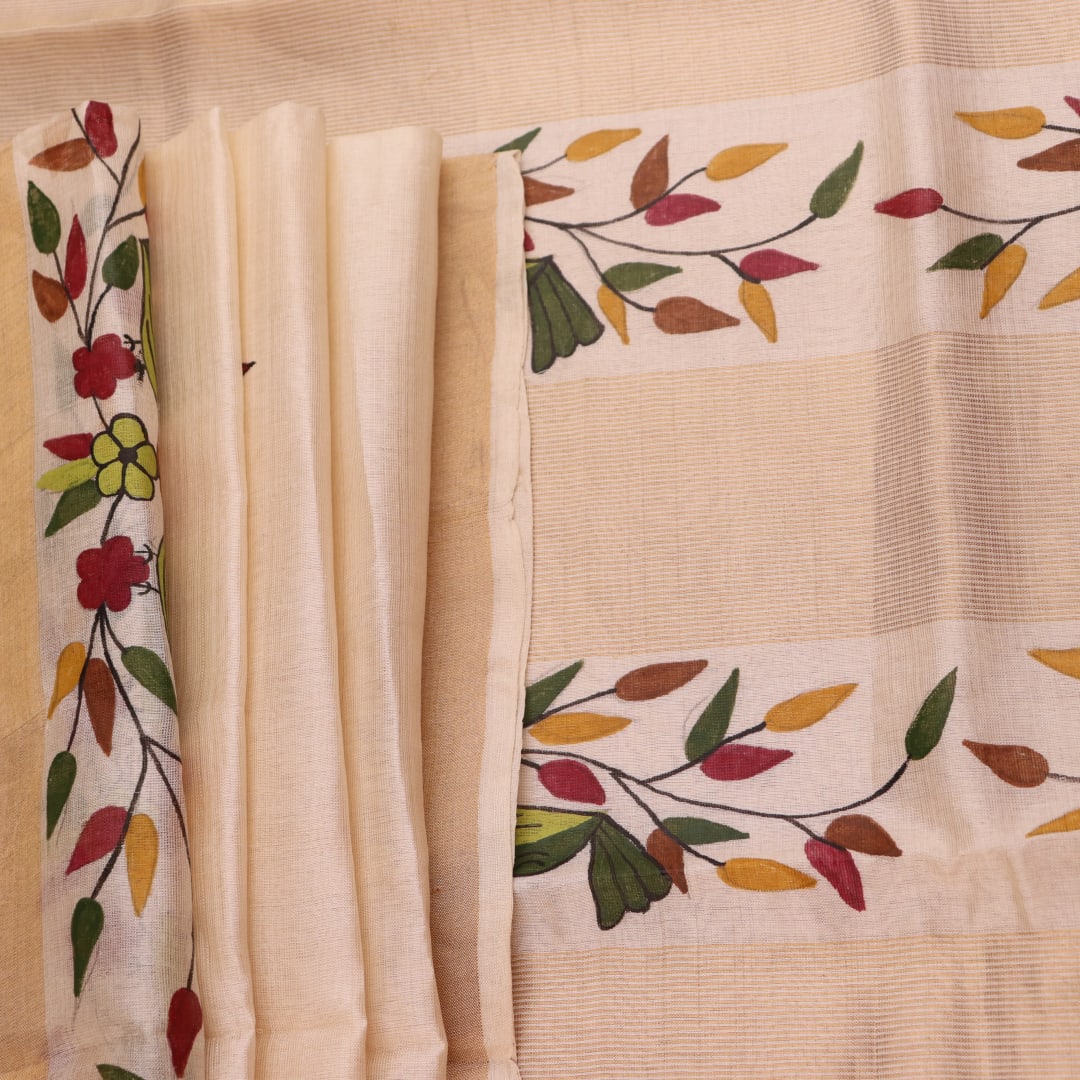 Close-up of off-white printed Tussar Silk saree fabric texture.