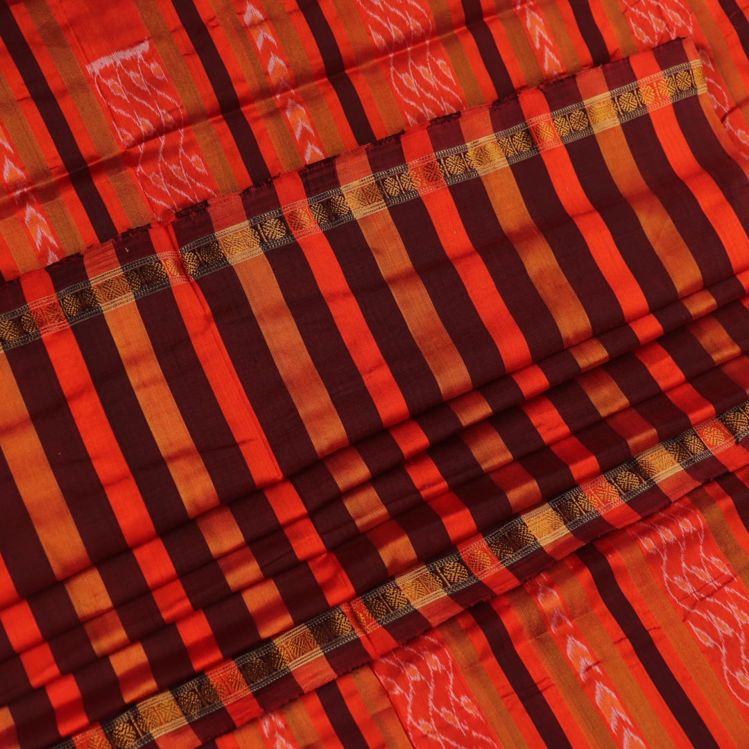 Close-up of multi-color striped Sambalpuri Silk Saree fabric texture.
