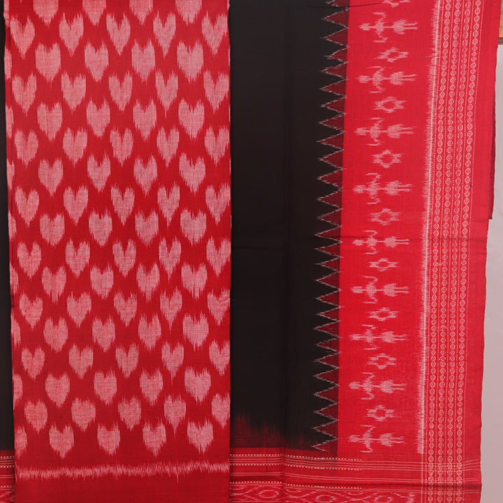 Detail of the Sambalpuri red-black cotton dress material blouse piece with motifs.
