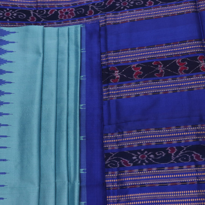 Close-up of plain blue Sambalpuri silk handloom saree fabric texture.
