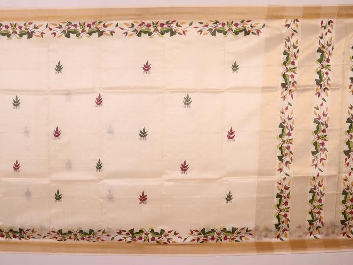 Close-up of off-white printed Tussar Silk saree fabric texture.