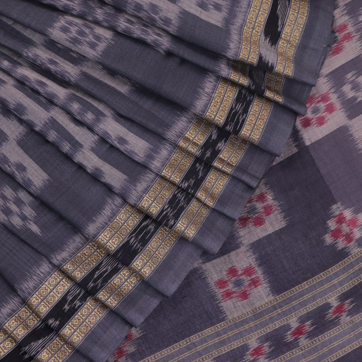 Draped view of white and grey Sambalpuri cotton saree with motifs.