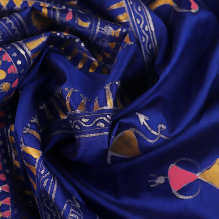 Close-up of handloom blue silk Patachitra saree, showcasing the detailed texture of the hand-painted fabric.
