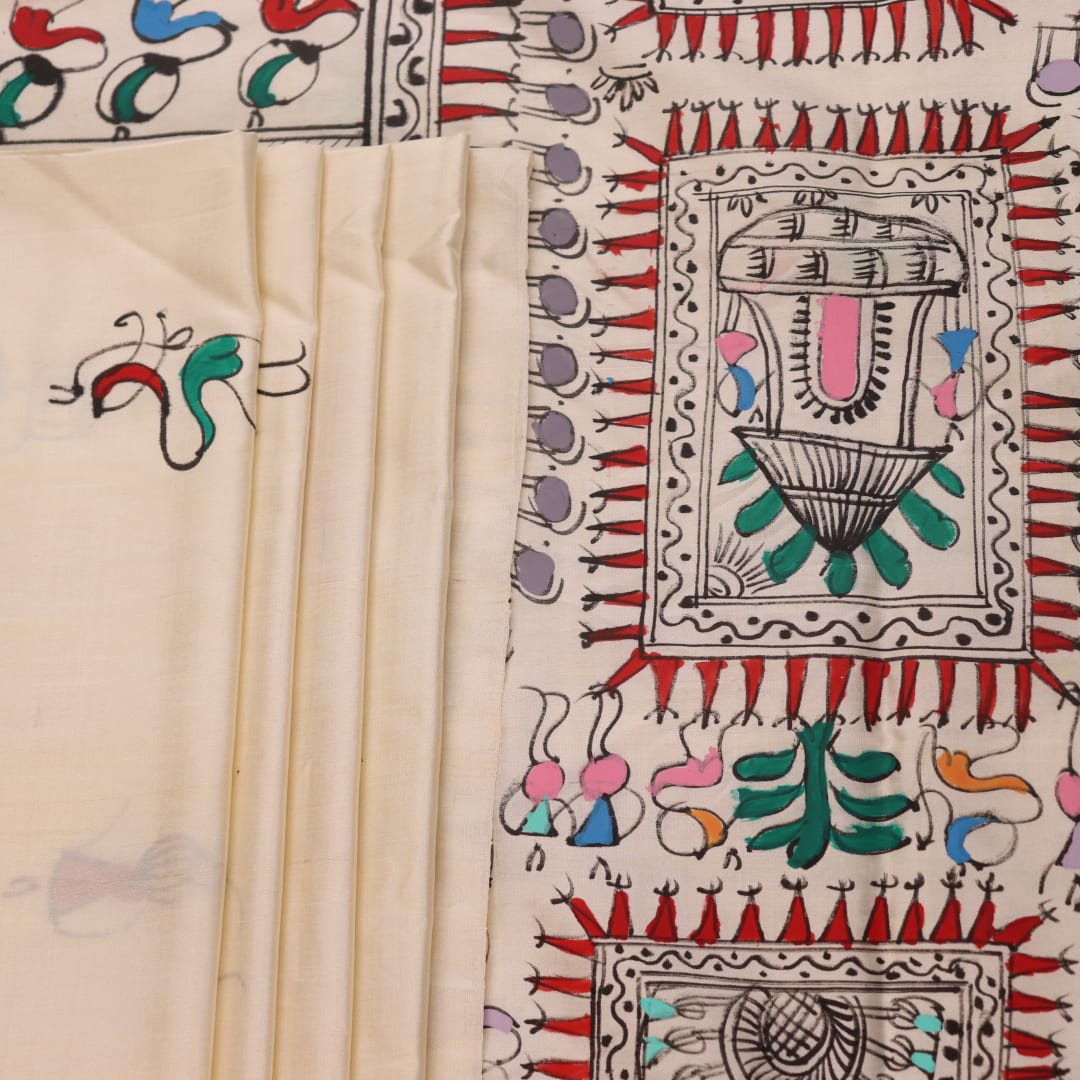 Close-up of the white silk saree fabric texture, showcasing the handloom weave and painted Patachitra details.