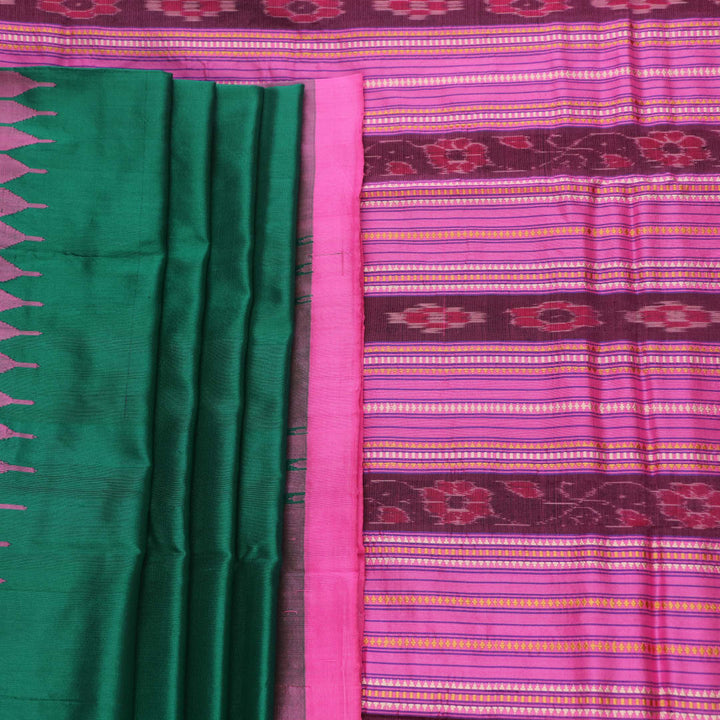 Close-up of plain green and pink Sambalpuri silk saree fabric texture.