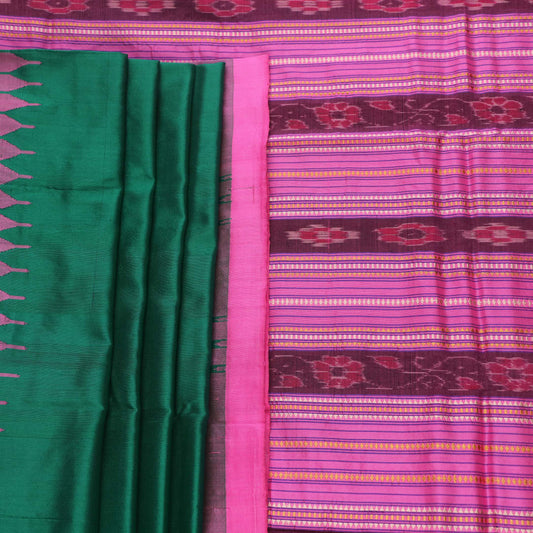 Close-up of plain green and pink Sambalpuri silk saree fabric texture.