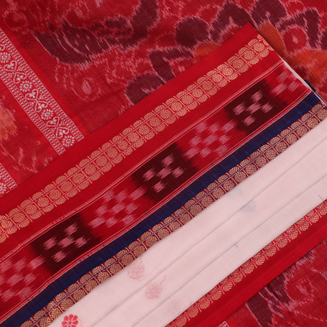 Full view of a white and red Sambalpuri cotton saree with butta pattern.