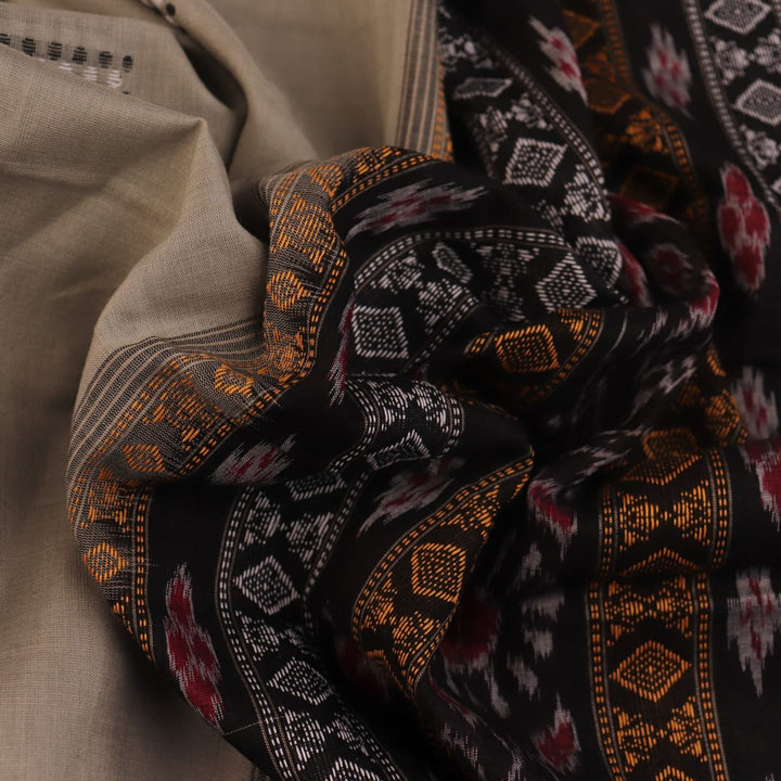 Full product view of a grey Bomkai cotton saree featuring black butta patterns.