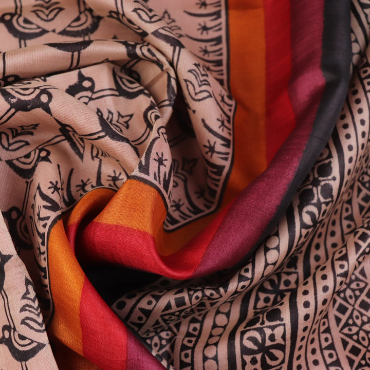 Close-up of off-white Tussar silk fabric, highlighting natural slubs and printed black pattern.