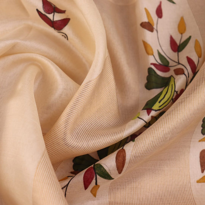 Close-up of off-white printed Tussar Silk saree fabric texture.