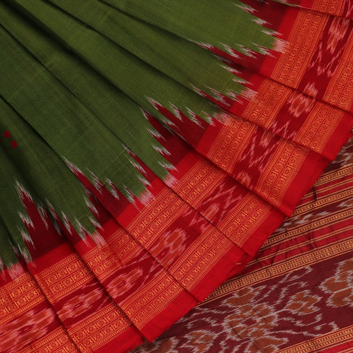 Green Khandua silk saree draped, showcasing its butta pattern and red accents.