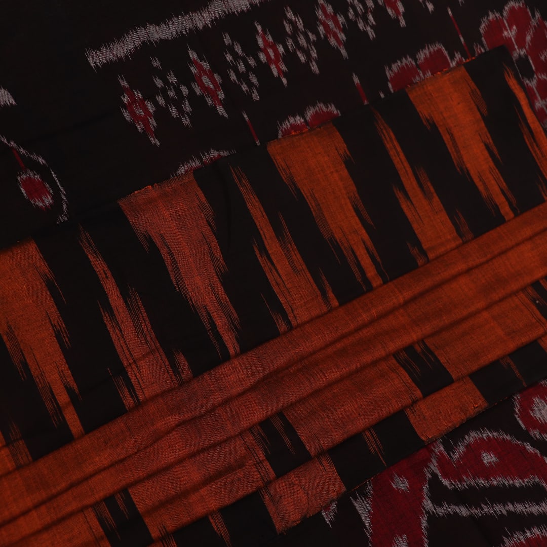 Brown and black plain Sambalpuri cotton saree elegantly draped.