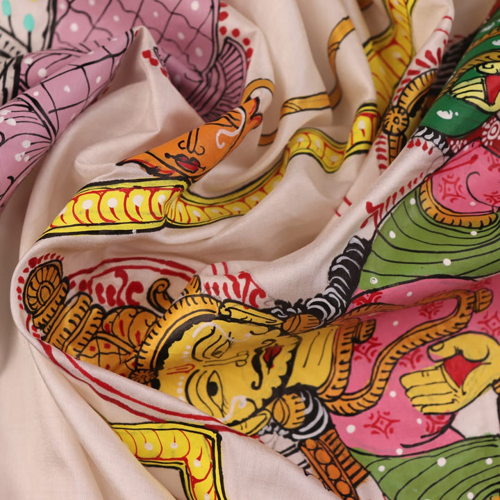 Close-up of handloom white silk Patachitra saree fabric showing texture and hand-painted details.