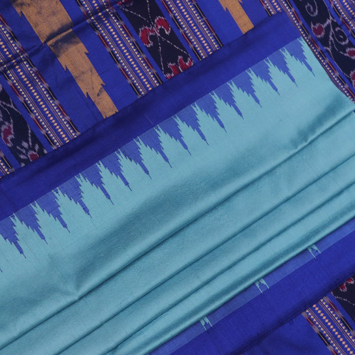 Close-up of plain blue Sambalpuri silk handloom saree fabric texture.