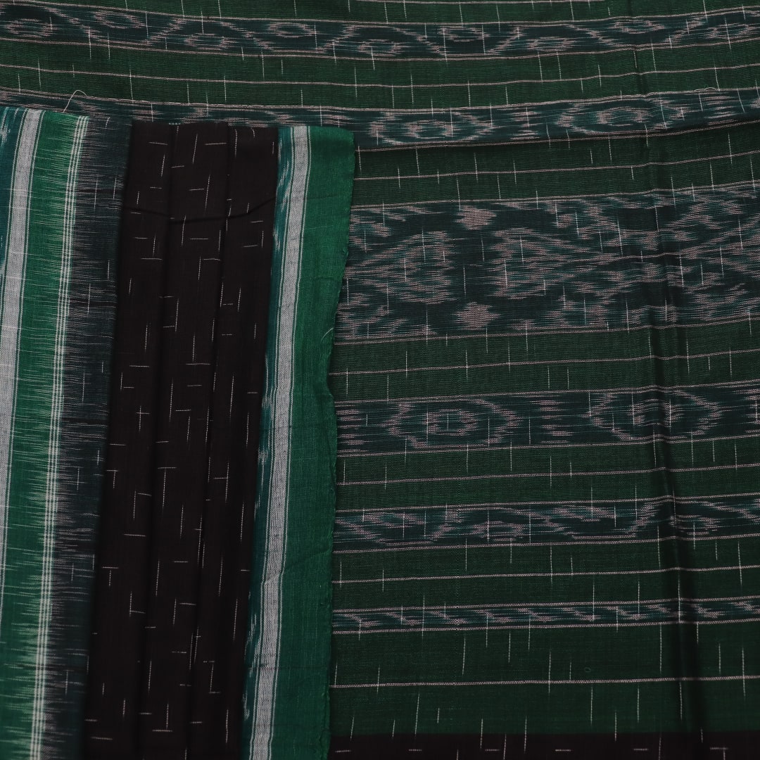 Black and green plain Sambalpuri cotton saree, gracefully draped.