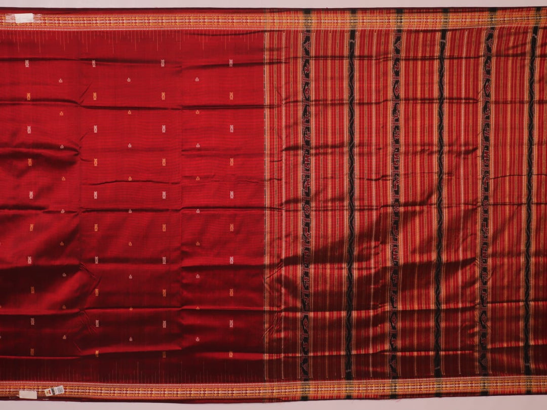Close-up of maroon Sambalpuri Silk Saree fabric, showing intricate butta weave texture.