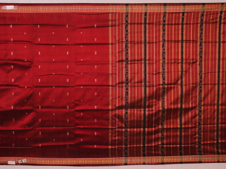Close-up of maroon Sambalpuri Silk Saree fabric, showing intricate butta weave texture.