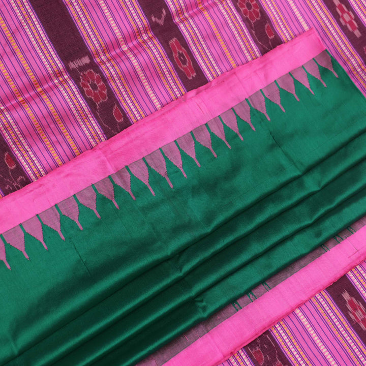 Close-up of plain green and pink Sambalpuri silk saree fabric texture.