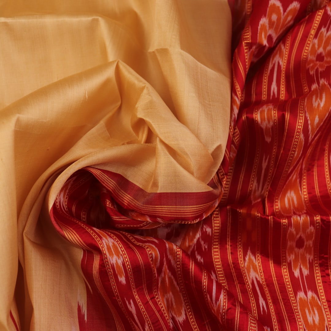 Saree styling: Cream Khandua silk saree with maroon butta pattern draped elegantly.