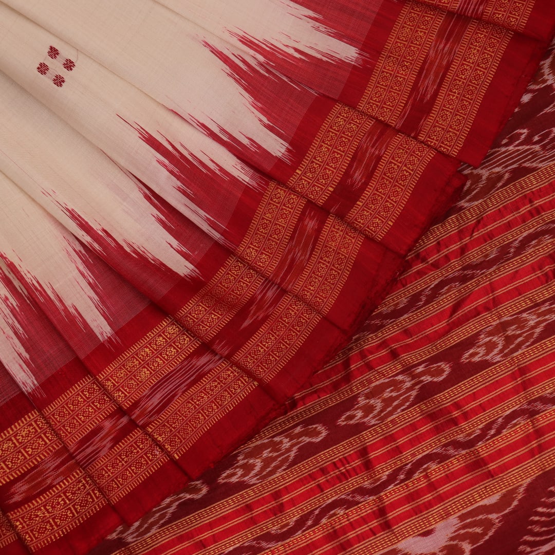 Khandua silk saree styled; white with red butta design, showcasing drape and overall look.