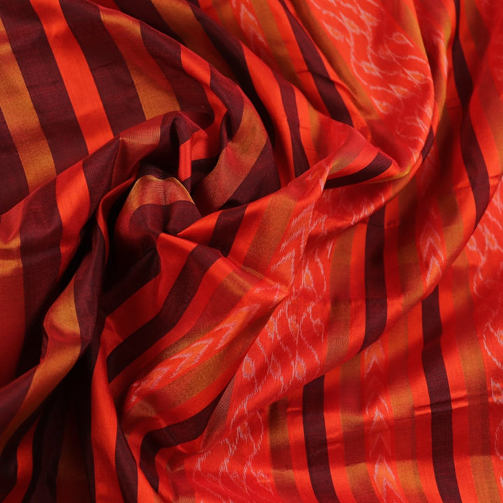 Close-up of multi-color striped Sambalpuri Silk Saree fabric texture.