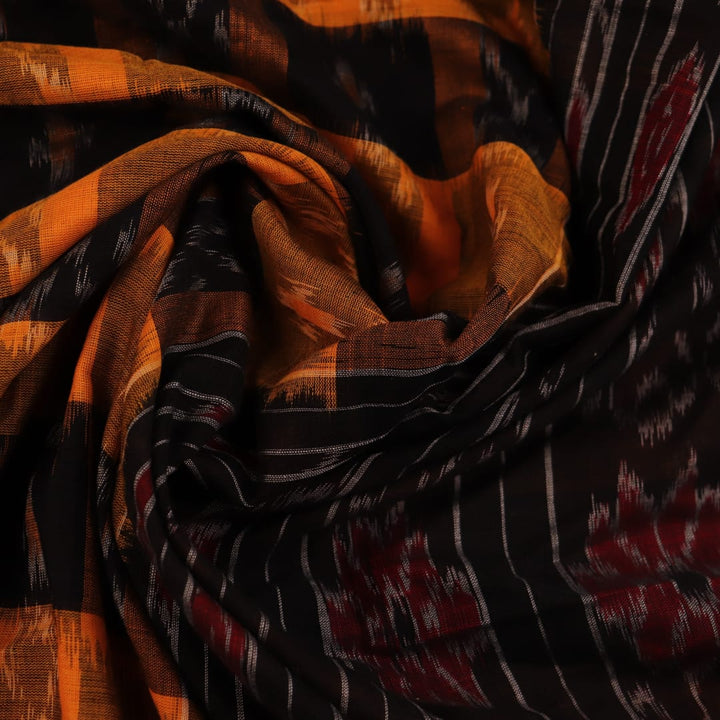 Stylishly draped yellow Sambalpuri cotton saree with black motifs