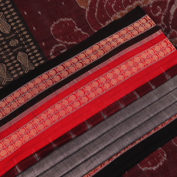 Full view of grey Bomkai cotton saree, featuring black border and butta pattern.