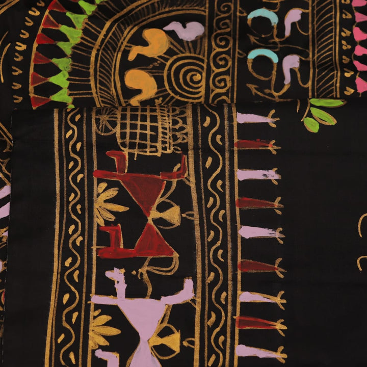 Close-up of the black silk Patachitra saree, showcasing the hand-painted fabric texture.
