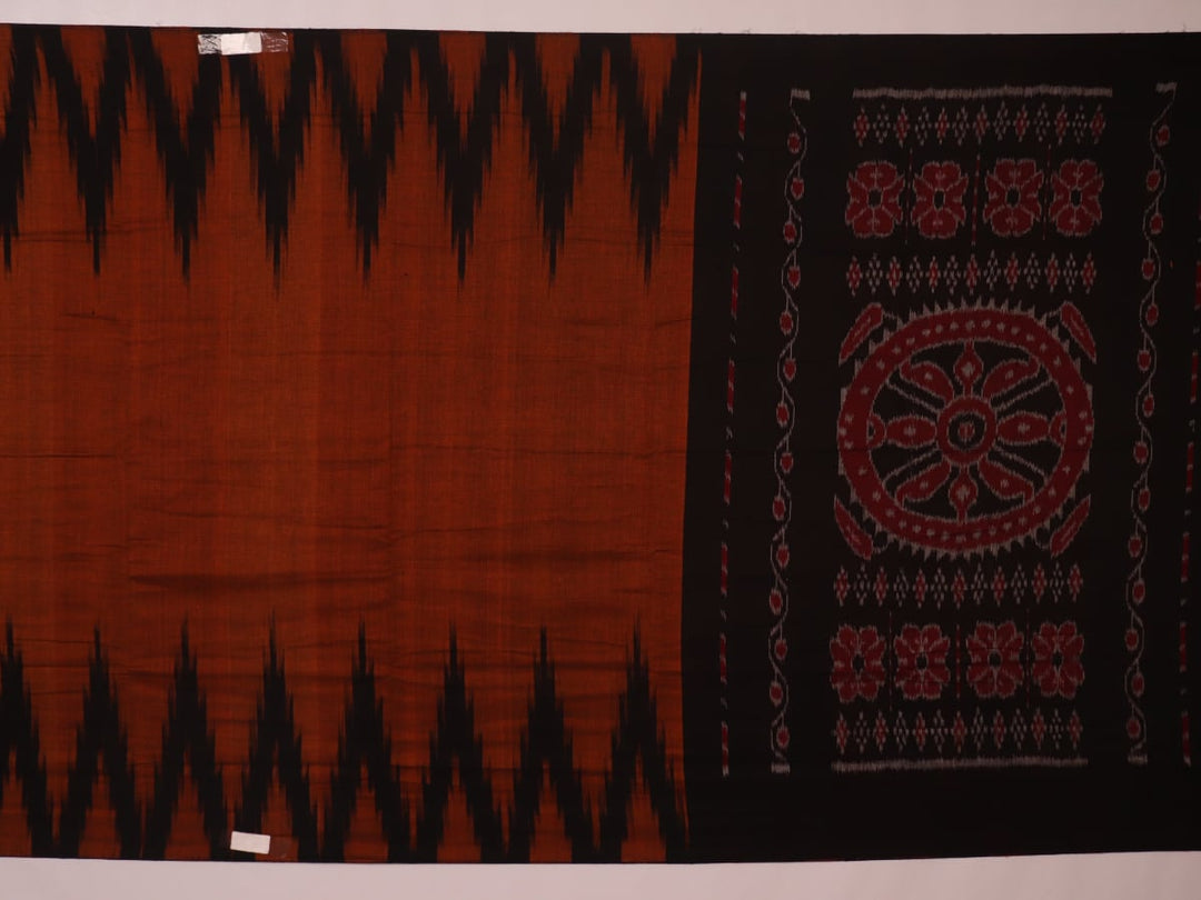 Brown and black plain Sambalpuri cotton saree elegantly draped.