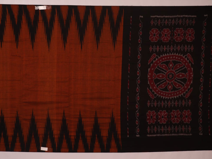 Brown and black plain Sambalpuri cotton saree elegantly draped.
