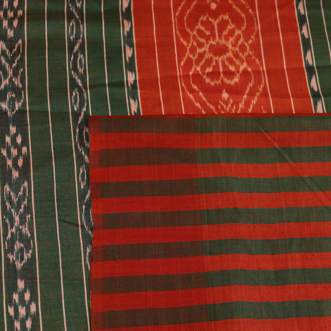 Close-up of plain off-white Tussar silk saree fabric, showing natural slub texture and rust weave.