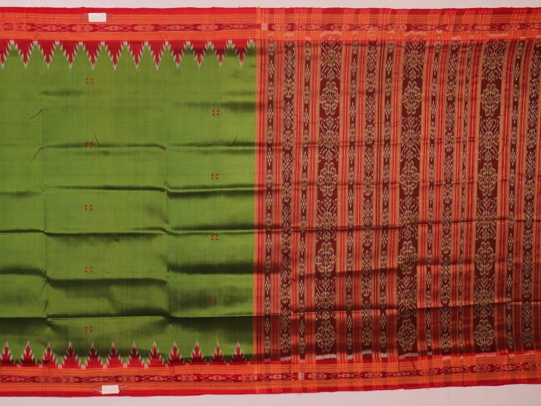 Green Khandua silk saree draped, showcasing its butta pattern and red accents.
