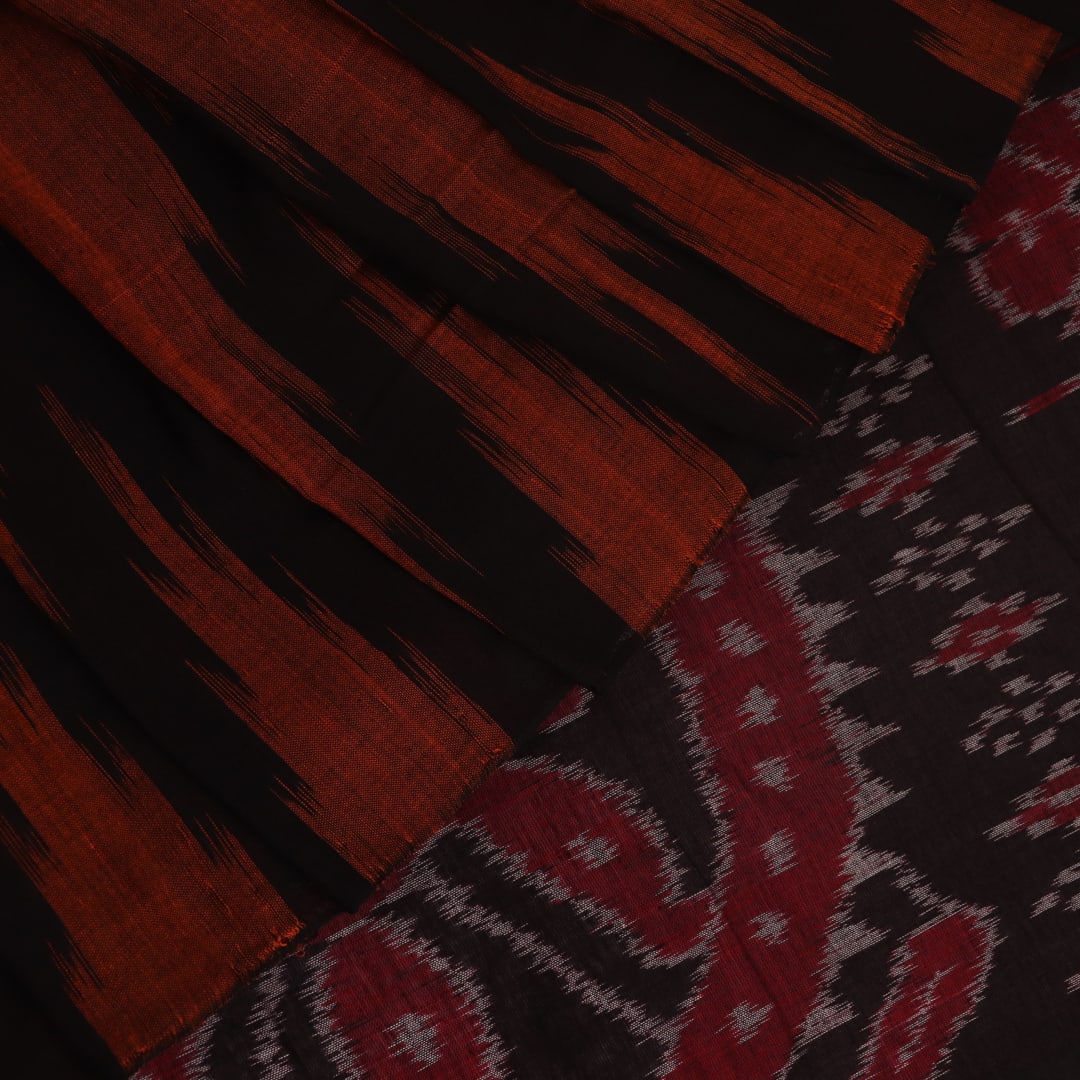 Brown and black plain Sambalpuri cotton saree elegantly draped.