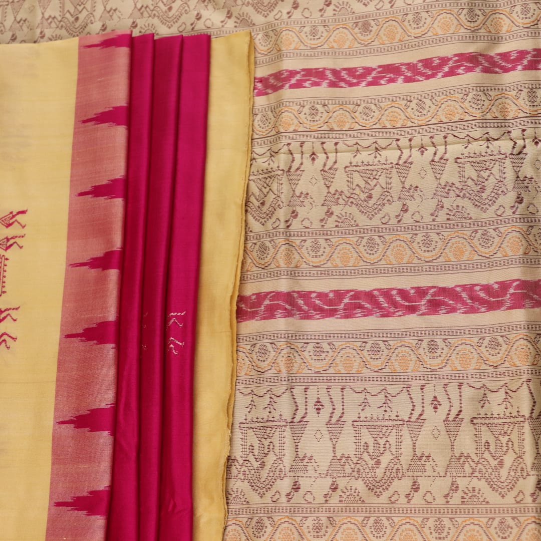 Close-up texture of pink and cream handloom Bomkai silk saree with butta pattern.