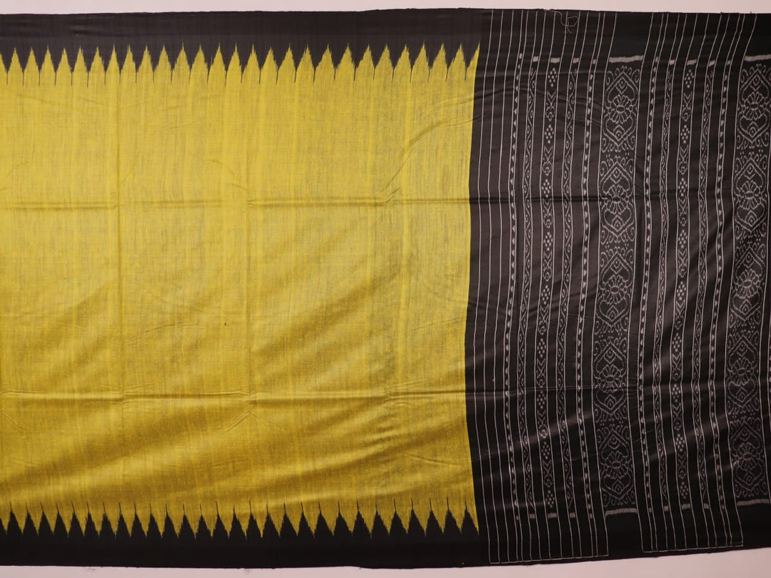 Close-up of the plain, slubby texture of a handwoven green and black Tussar silk saree.