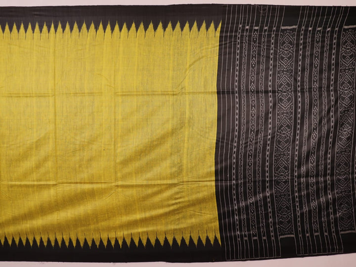 Close-up of the plain, slubby texture of a handwoven green and black Tussar silk saree.
