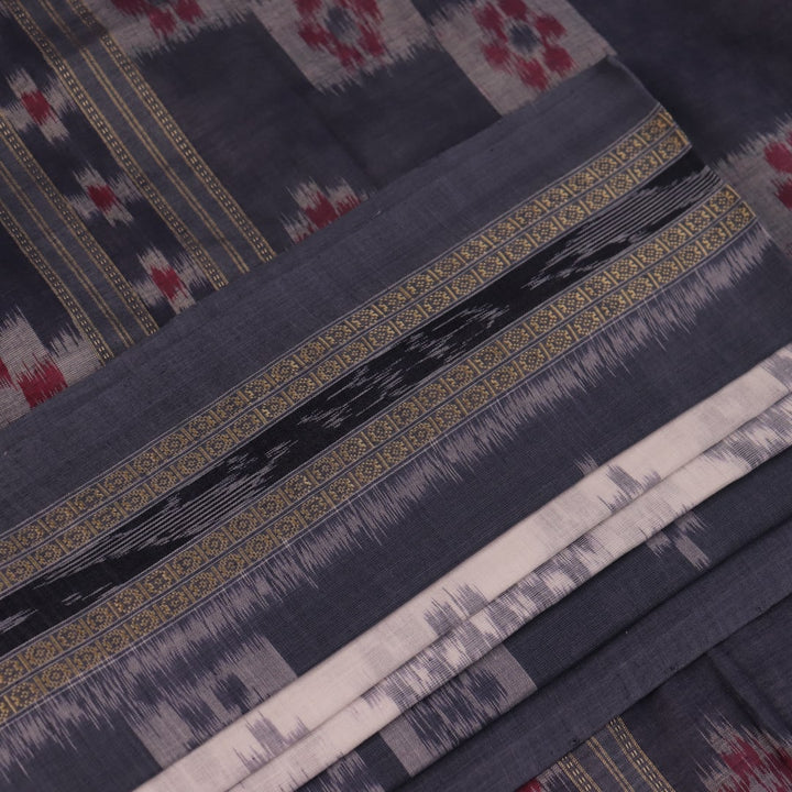 Draped view of white and grey Sambalpuri cotton saree with motifs.