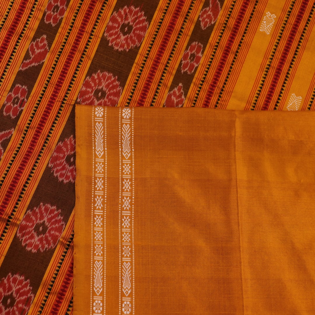 Close-up fabric texture of a magenta Sambalpuri Silk Saree with yellow butta pattern.