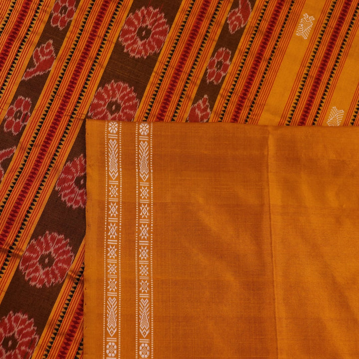 Close-up fabric texture of a magenta Sambalpuri Silk Saree with yellow butta pattern.