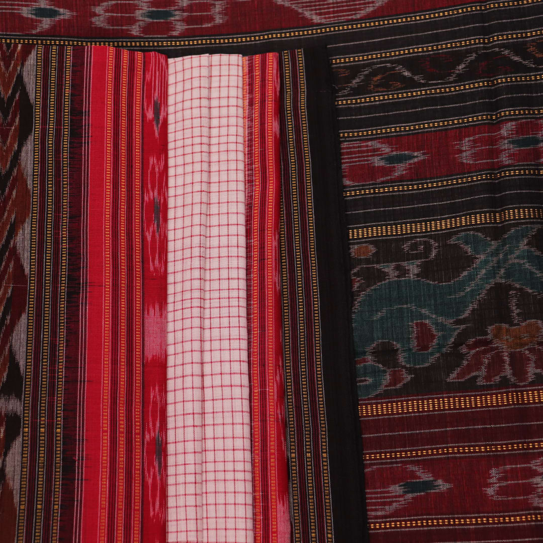 Saree styling: White and black Sambalpuri cotton saree with motifs, draped to showcase the overall look.