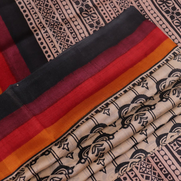 Close-up of off-white Tussar silk fabric, highlighting natural slubs and printed black pattern.