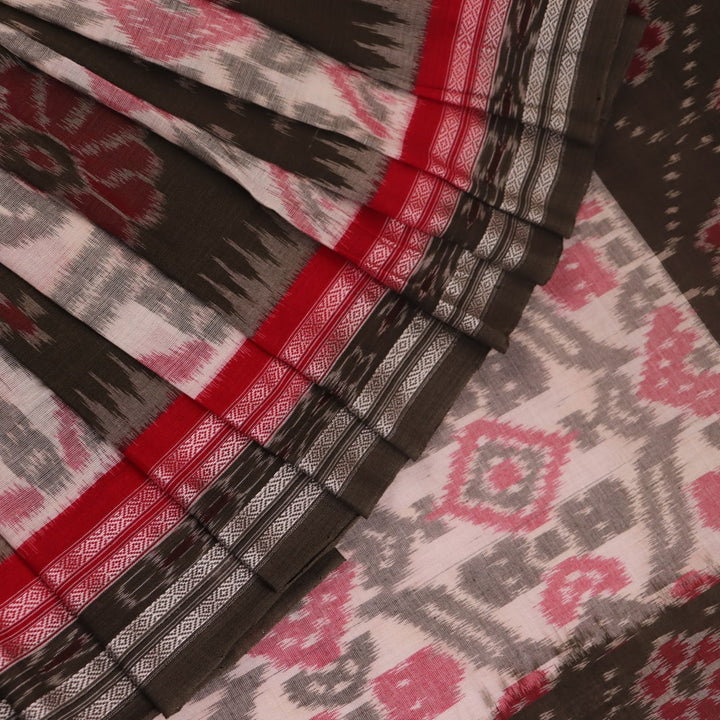 Off-white Sambalpuri cotton saree with green motifs, elegantly draped.