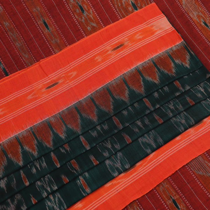 Green and orange Sambalpuri cotton saree draped, showcasing the motif pattern.