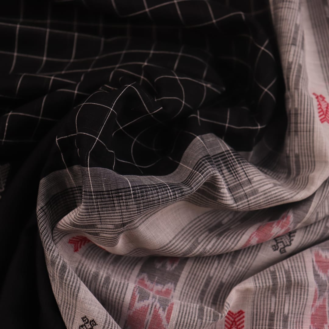 Full view of a Black and White Sambalpuri Cotton Saree with Butta pattern.